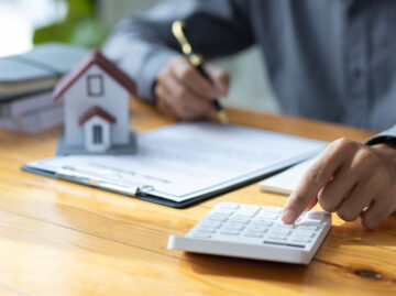 business-people-calculating-interest-taxes-and-pr-2023-11-27-05-09-16-utc